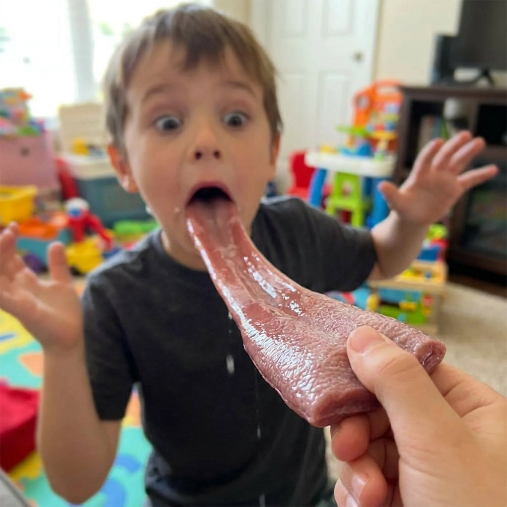 Kid pulling the stretchy fake tongue with a shocked face